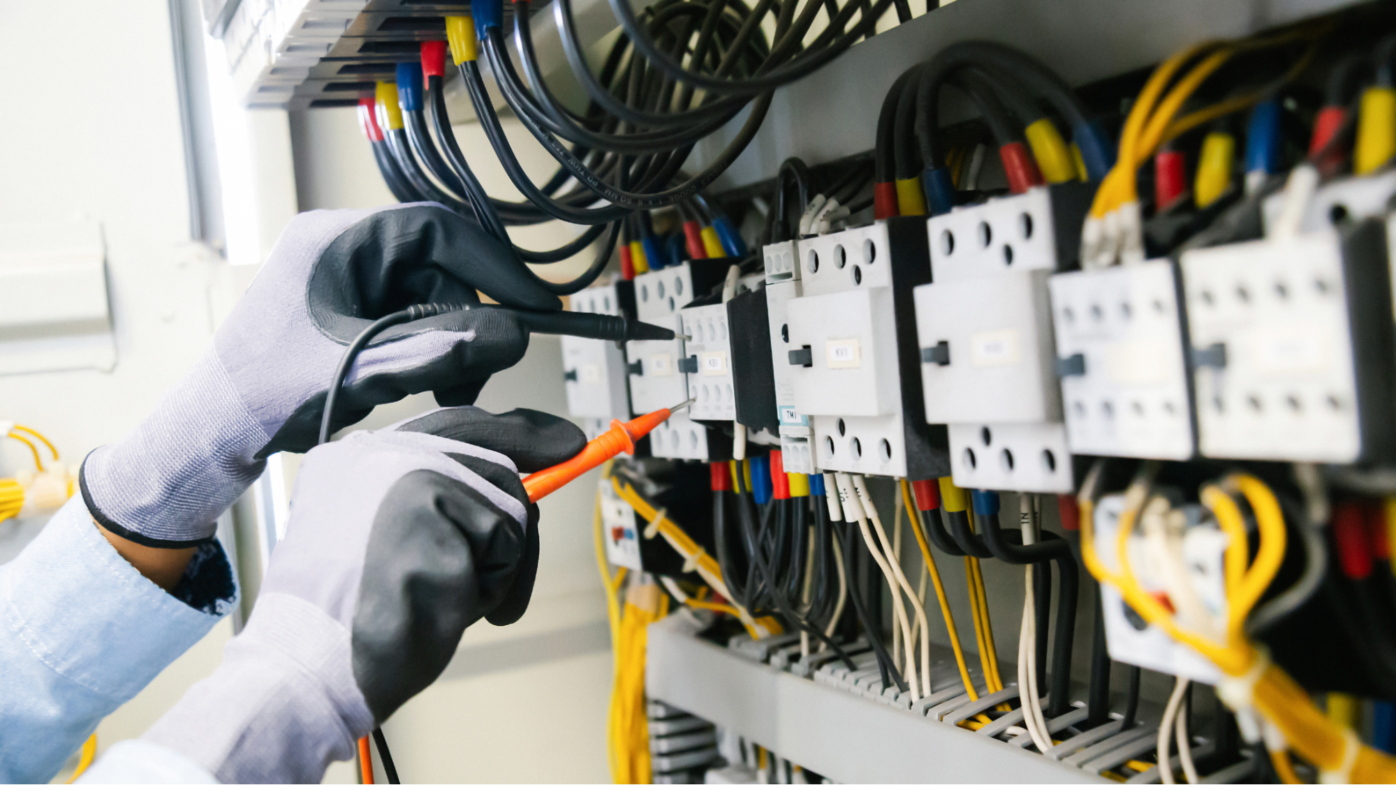 Electrician working on a panel